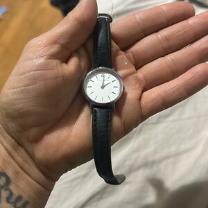 Larsen and Jennings black leather strap watch with silver face